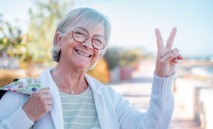 Portrait of smiling senior caucasian woman in outdoors looking a